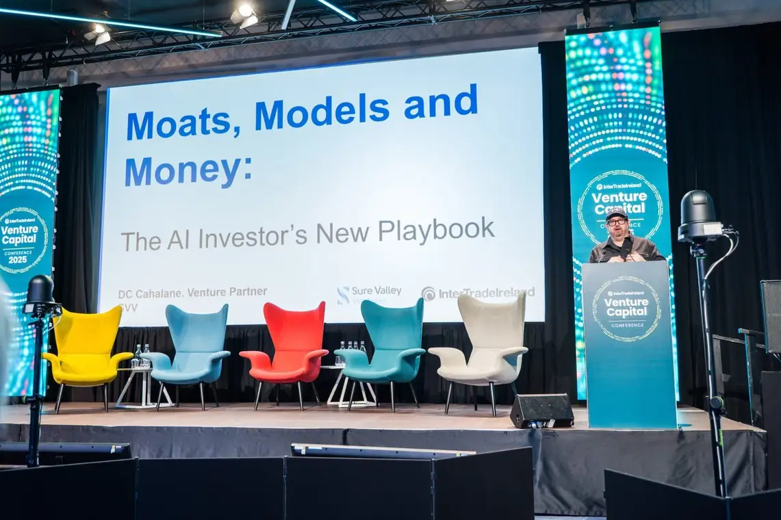 DC Cahalane on stage presenting Moats, Models and Money